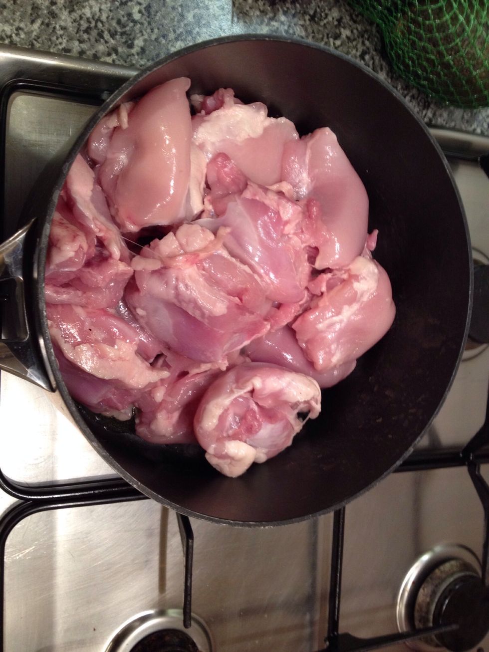 Put a large saucepan on medium heat. Add oil and the chicken. Fry for 10 minutes. Then remove onto a plate.