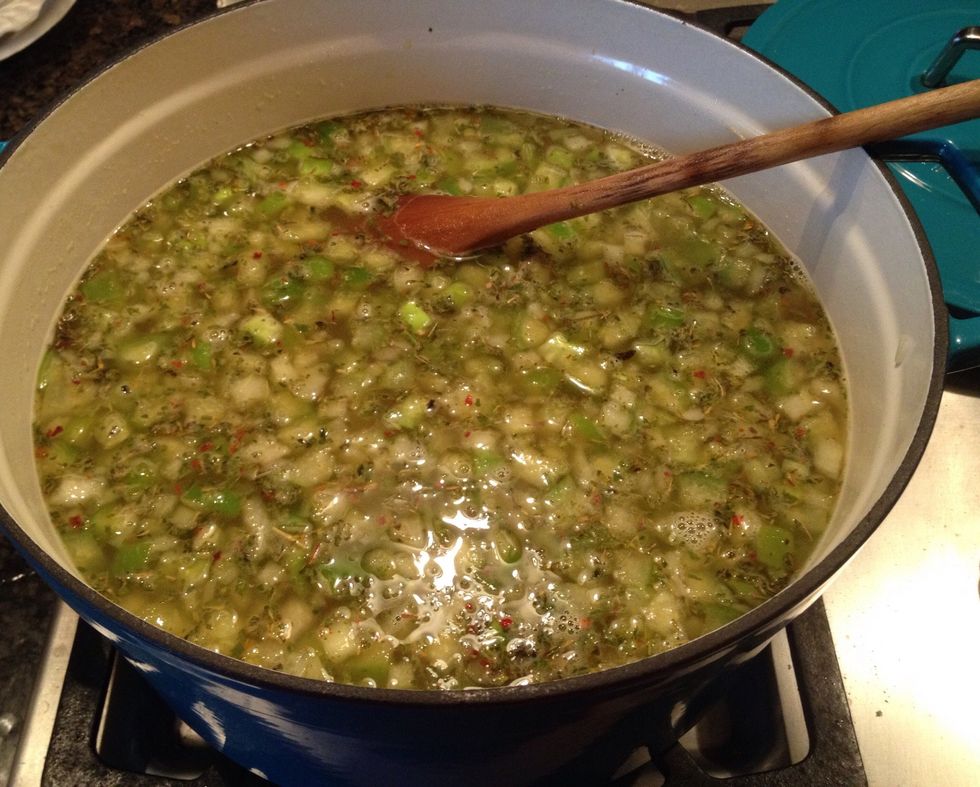 Put a lid on it, and let the stock pot simmer while the chicken is finishing in the slow cooker.