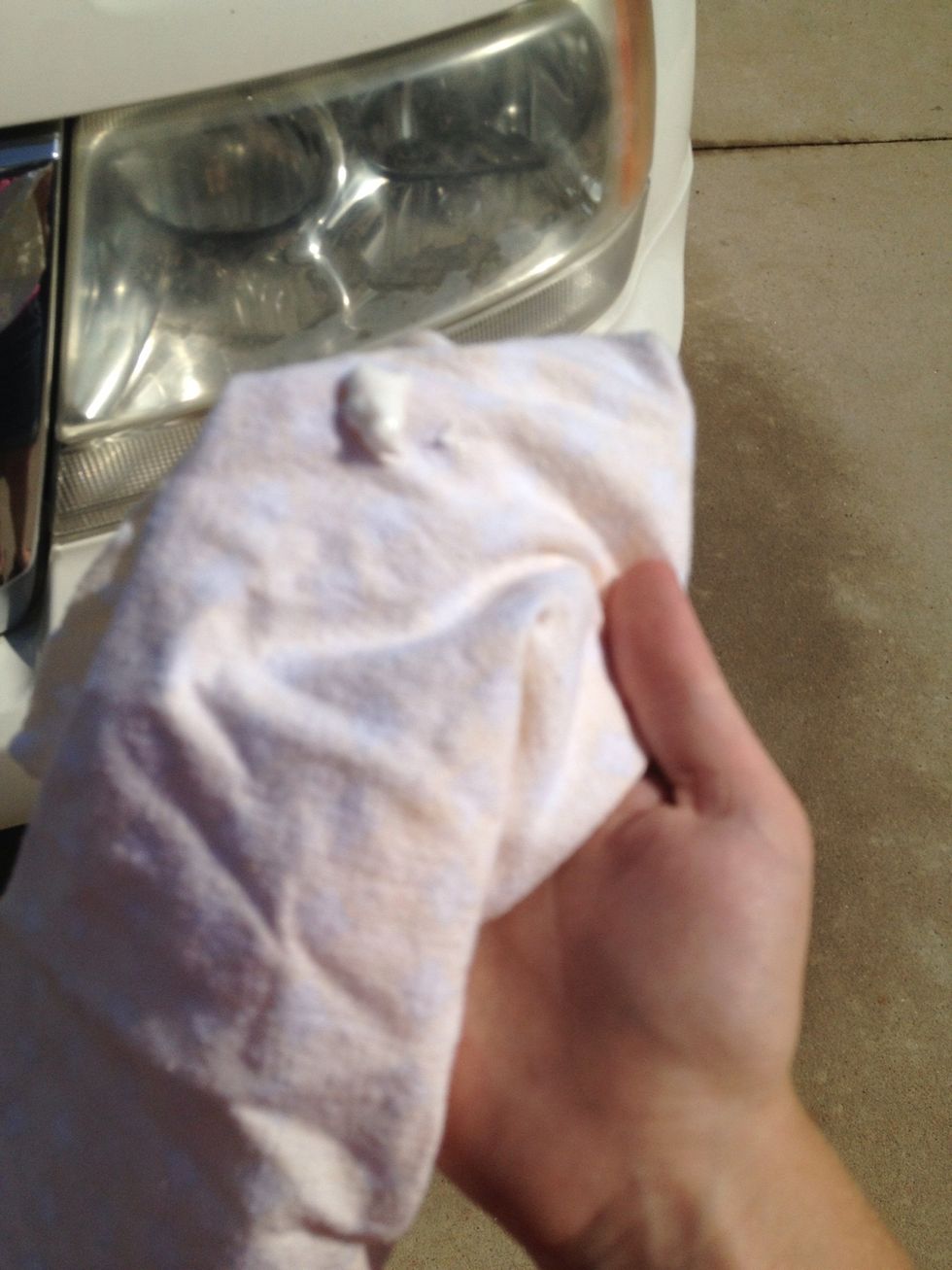 Put a little bit of toothpaste on rag.
