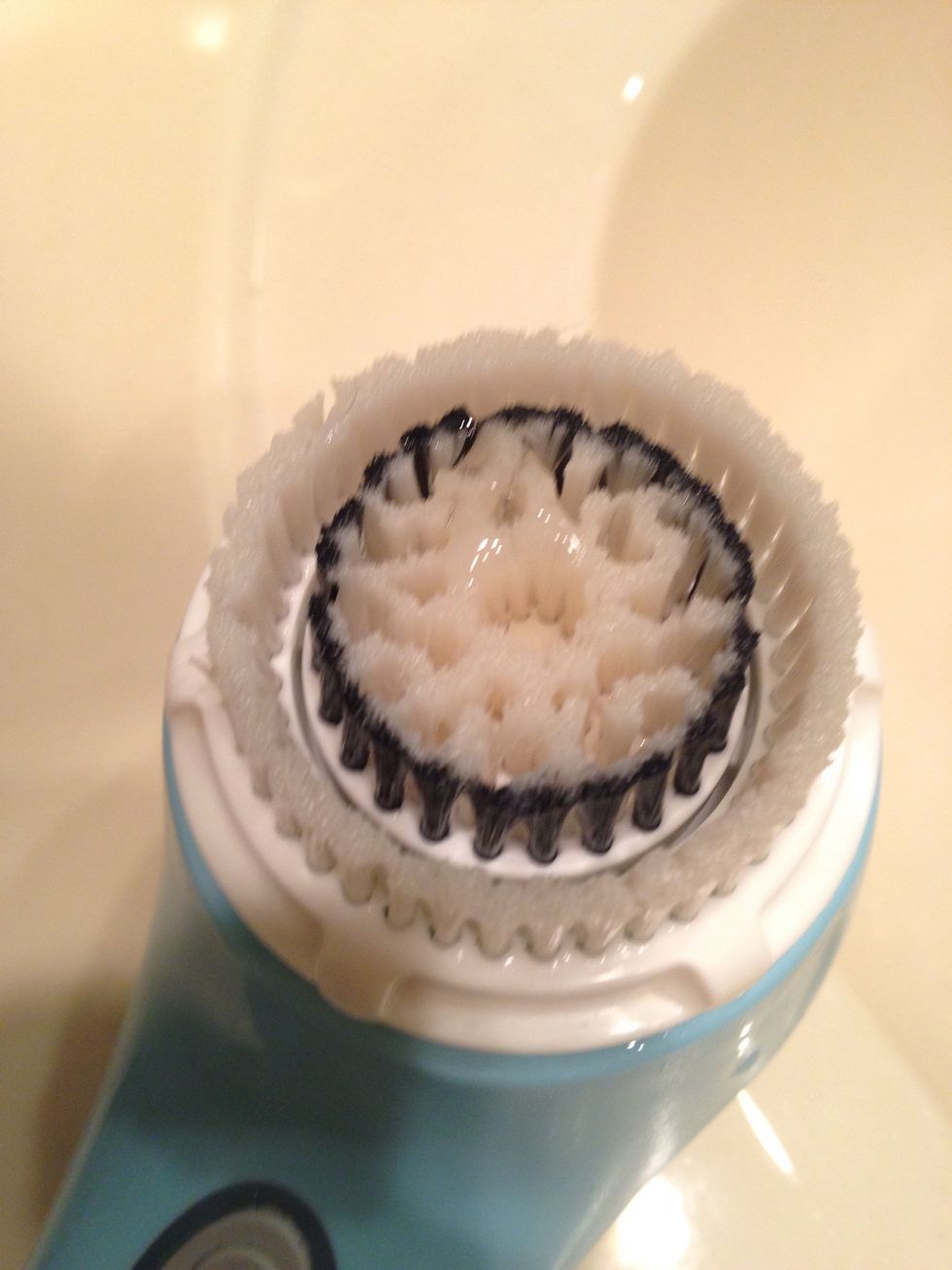 Put a little bit on your brush head. I like to put mine in the little hole and then a little in the outside, but that's just me!! There is no right or wrong on where you put it!