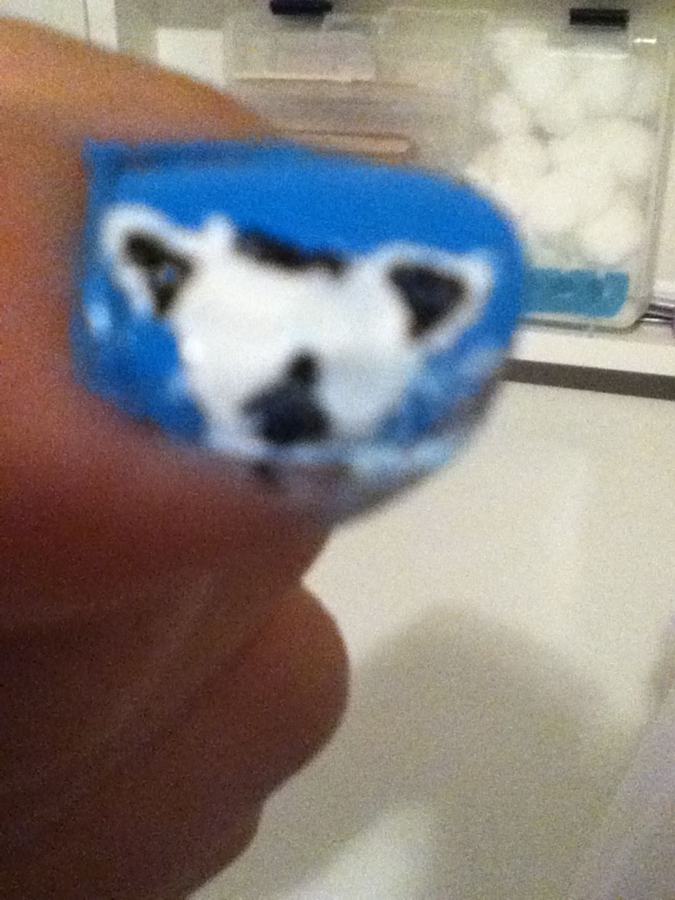 Put a little black on the forehead and mouth area