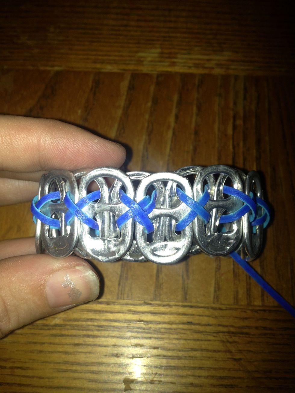 Put a little crazy glue on the knot and let it sit for 5 mins so the knot doesn't come undone and so you don't have to re-lace your entire bracelet again, after cutting the excess lace.