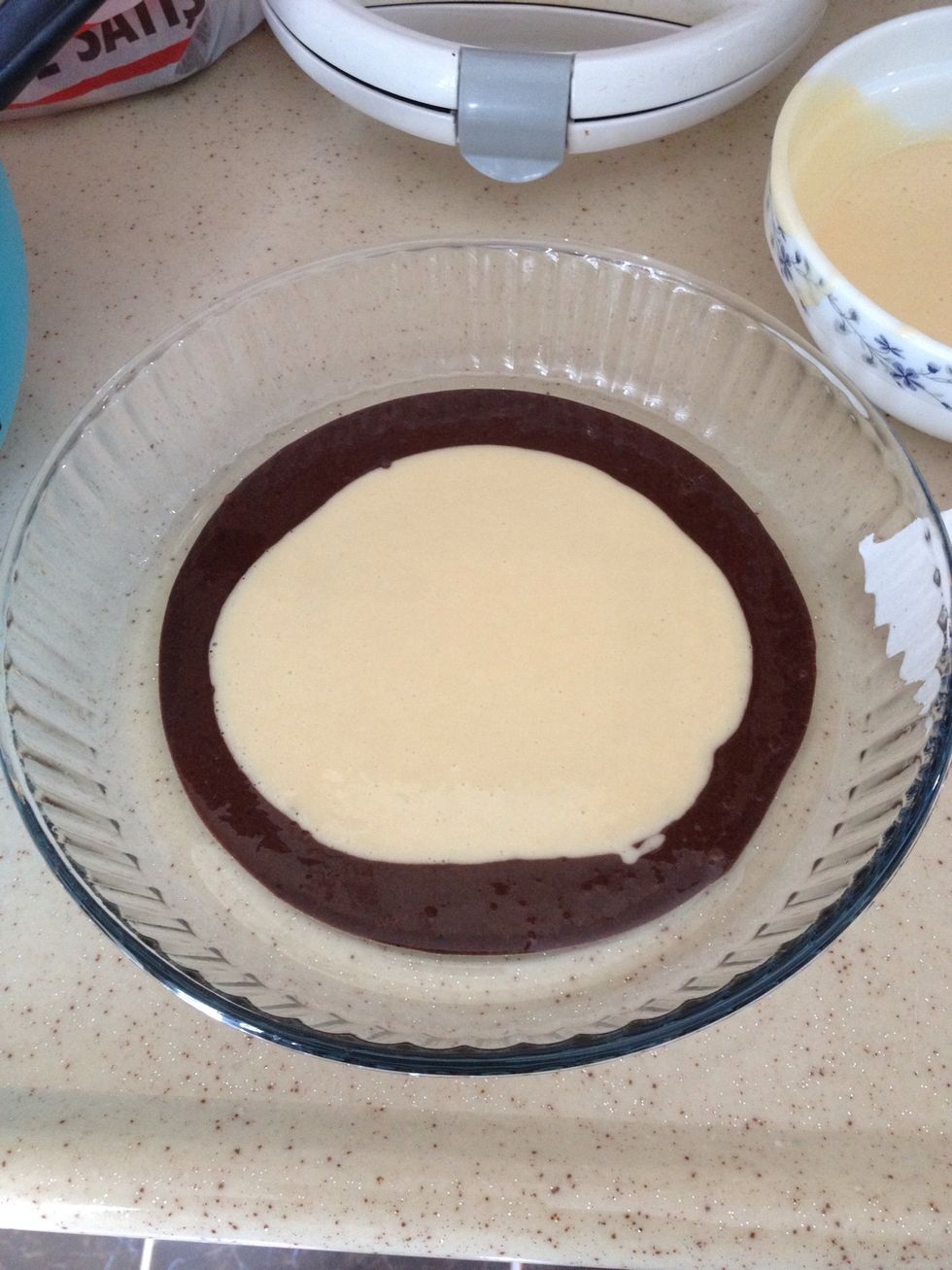 Put a little of your white cake dough and then on top of it put a little bit of your black cake dough \ud83d\ude09
