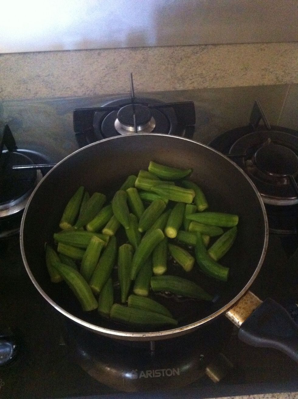 Put a little oil and put some of the okra and brown them but not too much