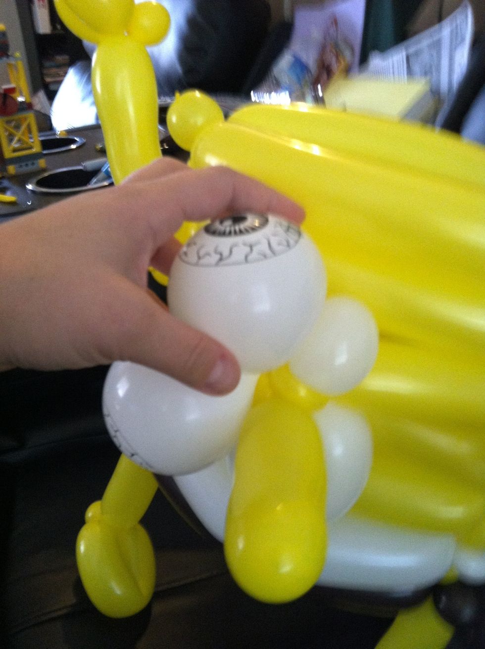 Put a little pinch twist in each eyeball to make them look straight instead of to the side (not necessary of you are using unprinted balloons)