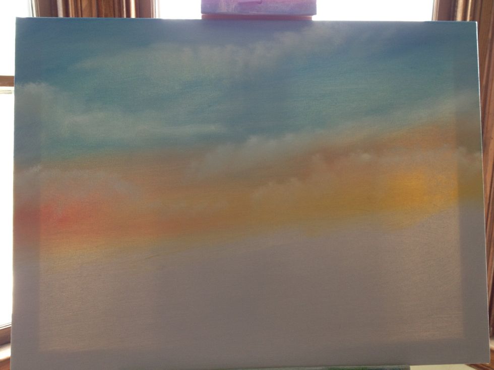 Put a little yellow on a chip brush & go to the center of the canvas. Make little X patterns across the canvas to make your yellow sunset. Repeat with red & blue & white. Blend with light strokes.