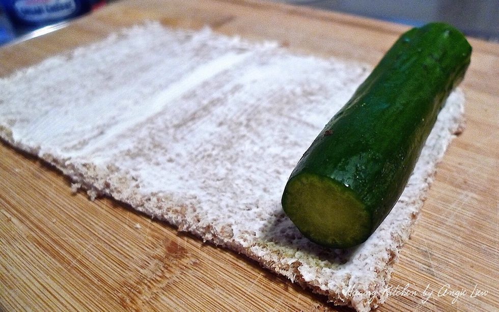 Put a long, thin, unpeeled green zucchini at one end of the bread.