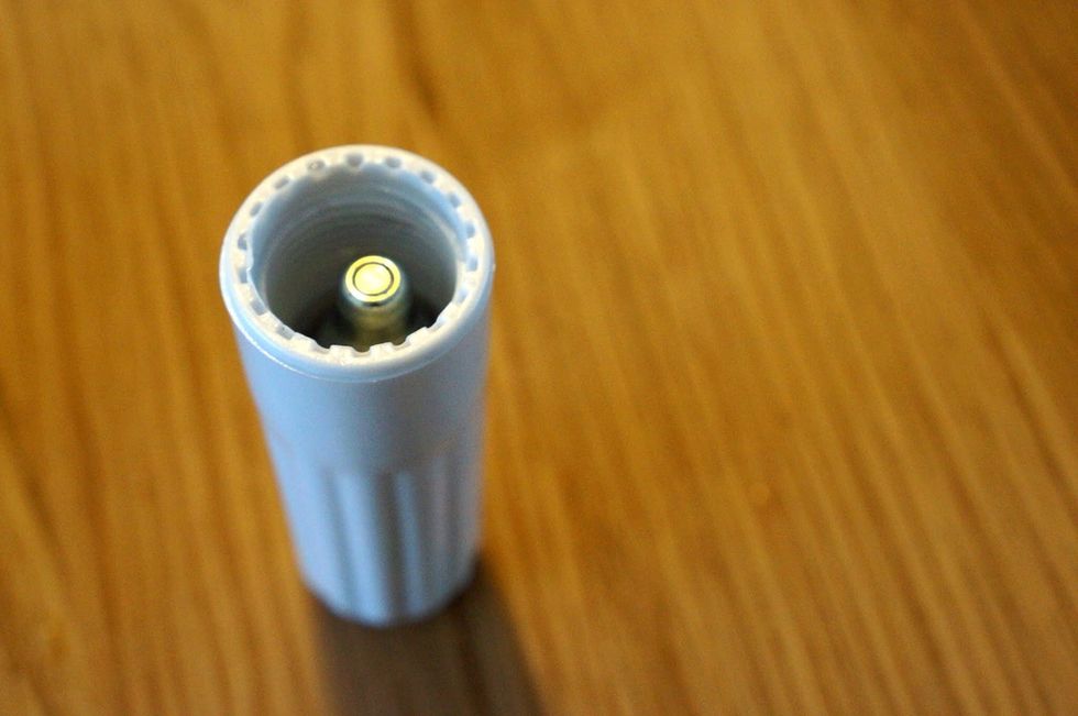 Put a new pressure cartridge into the white holder.