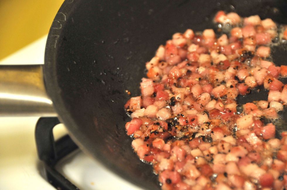 Put a pan over medium to high heat. Add the pancetta and a couple twist of your pepper grinder. Pancetta is all about pepper but American versions seem to lack the pepper flavor of the Italian stuff.