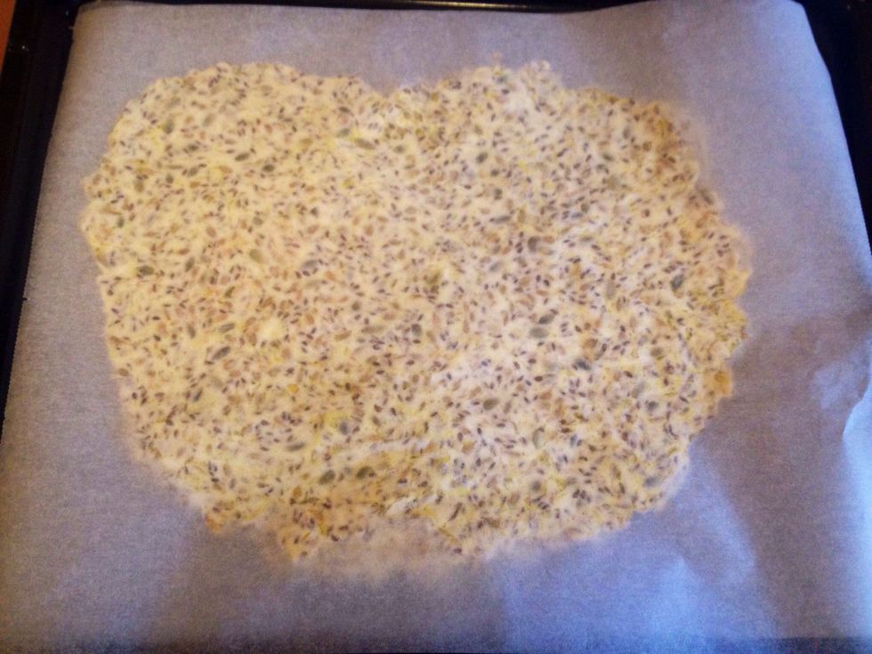 Put a parchment paper on top of the dough to flatten it out.