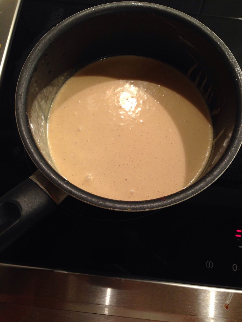 Put a part of the curd mixture in a pan and heat it until it's warm
