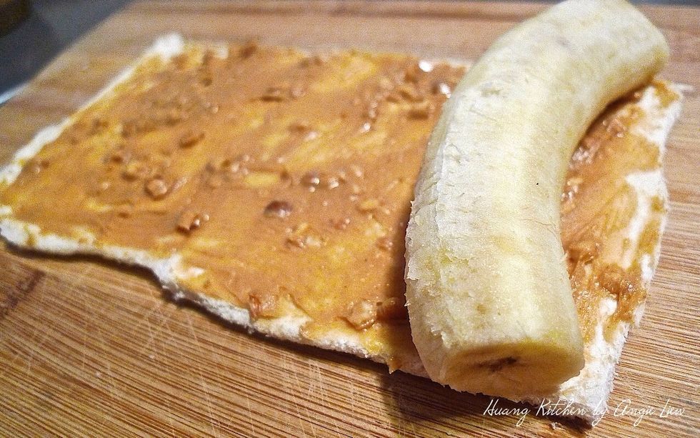 Put a peeled ripe banana at one end of the bread.