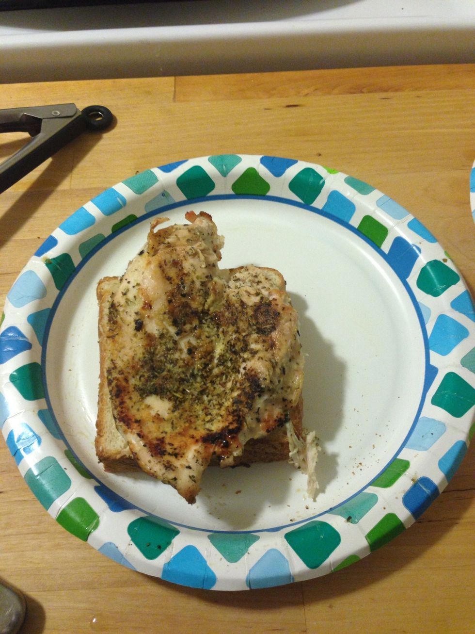 Put a piece of chicken on a slice of toast and cover it with another slice.