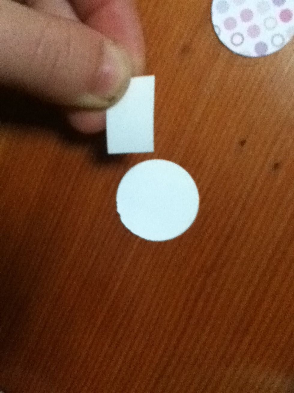 Put a piece of double sided tape on both of your paper circles.
