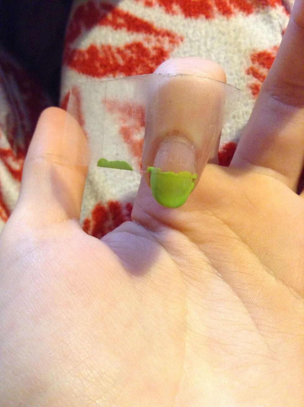 Put a piece of tape across half of your pointer finger, paint green