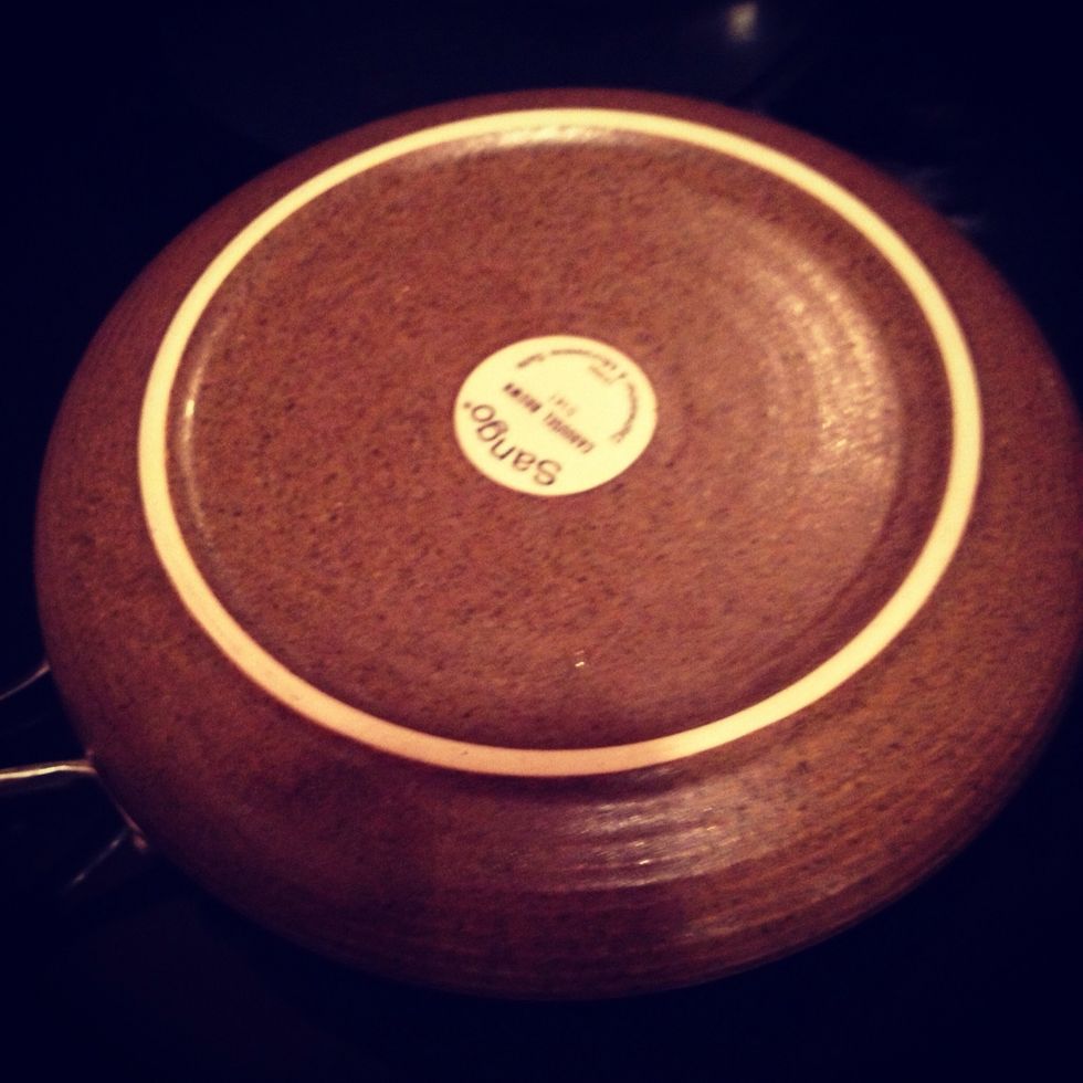 Put a plate over when you fill the botton is cook. Put your hand over the plate, grab the pan and flip it 180 degrees without fear until the cook part is on the botton of the plate.