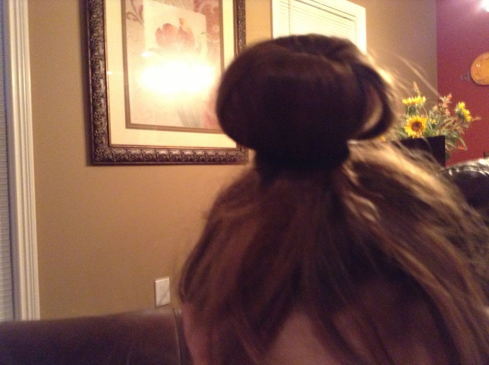 Put a ponytail on top of the bun like this