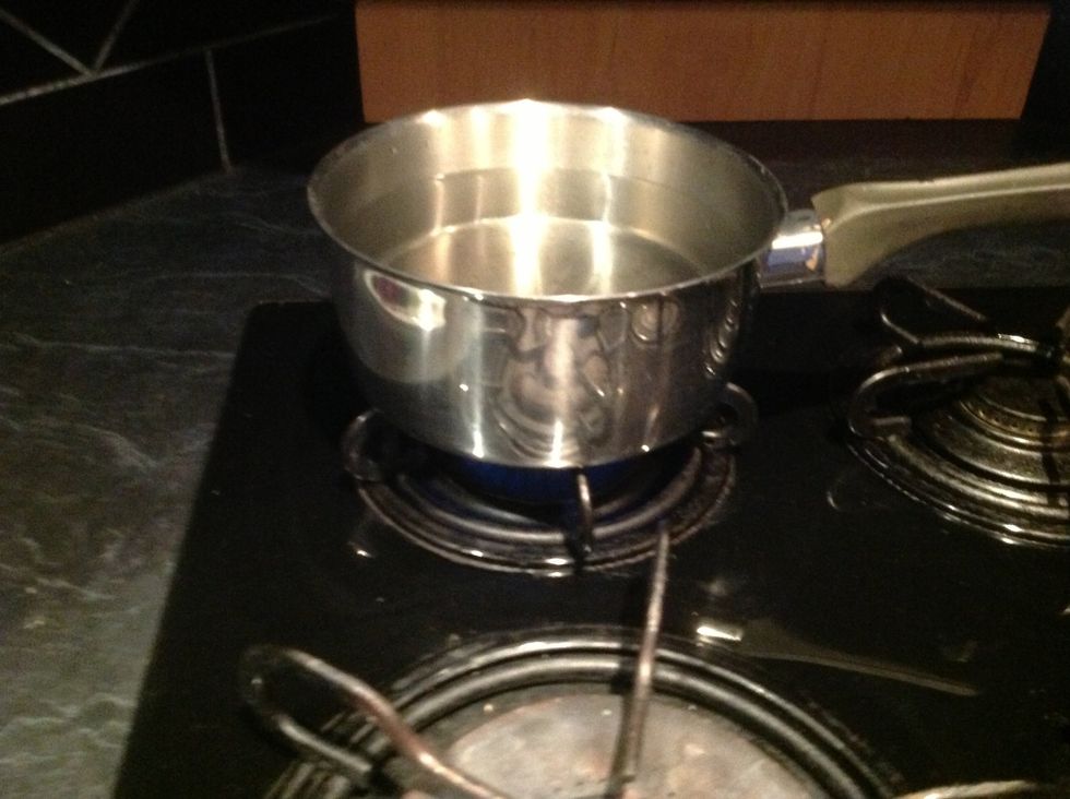 Put a pot of water onto boil