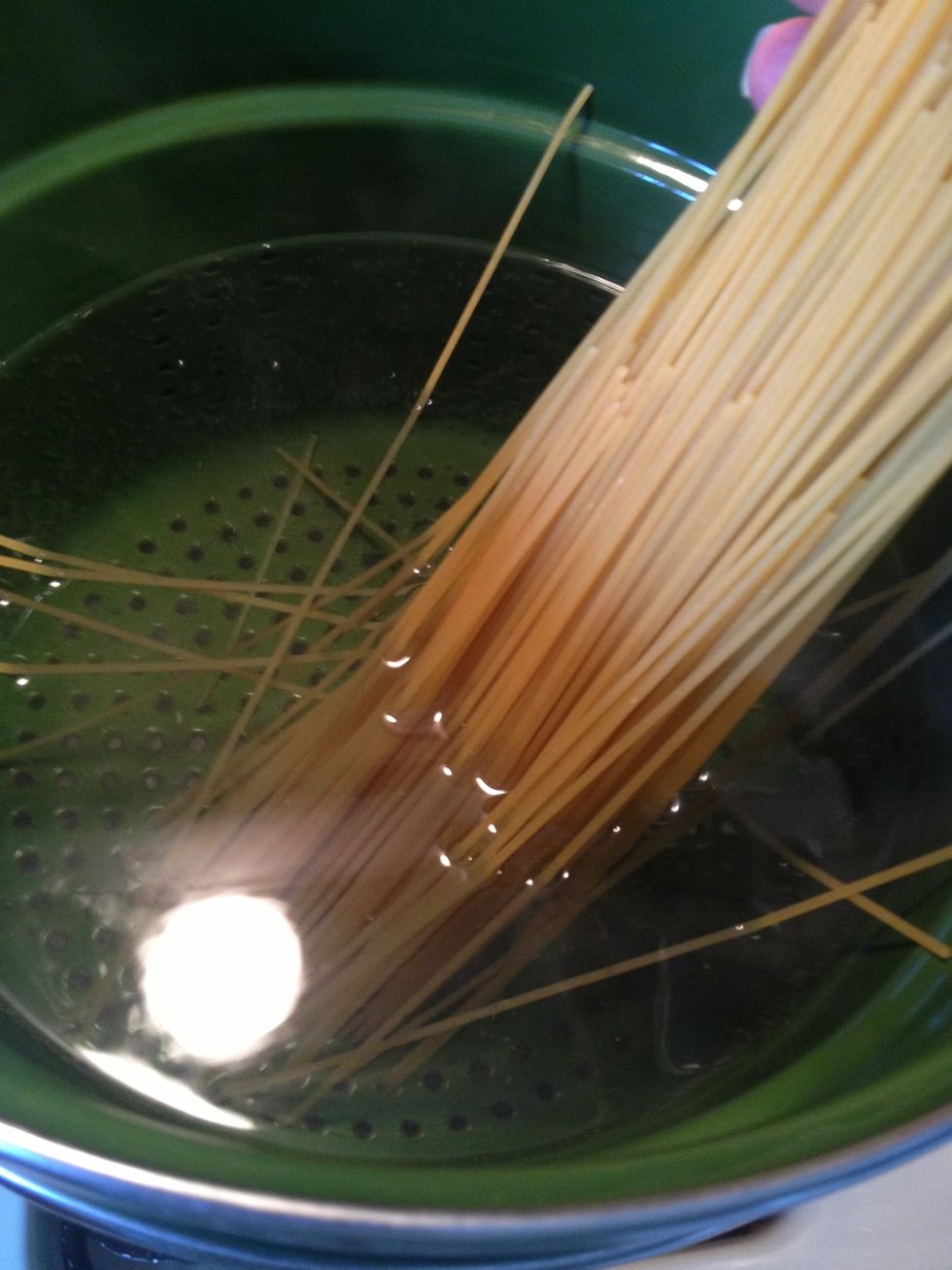 Put a pot of water to boil and add your spaghetti. Cook until al dente.