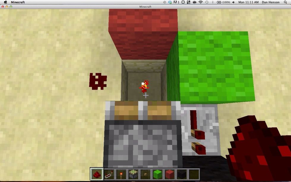 Put a red stone torch in the hole and red stone beside it. The redstone there is your output.
