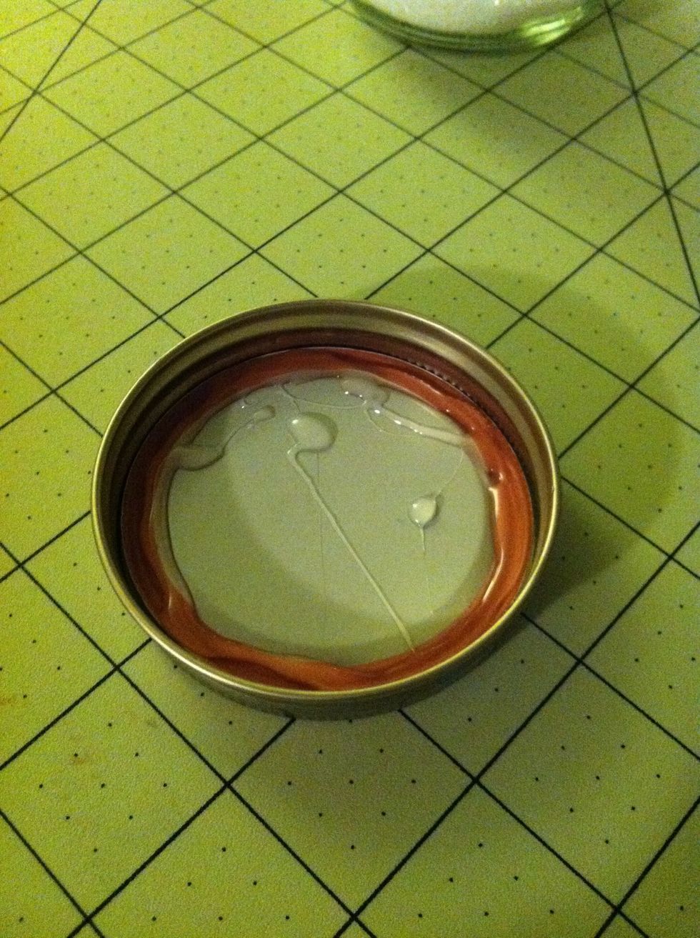 Put a ring of glue around the inside of the lid. Mine got a little messy. That's the only thing I would change about this glue, it comes out of the tube all crazy sometimes. Put the lid on the jar.