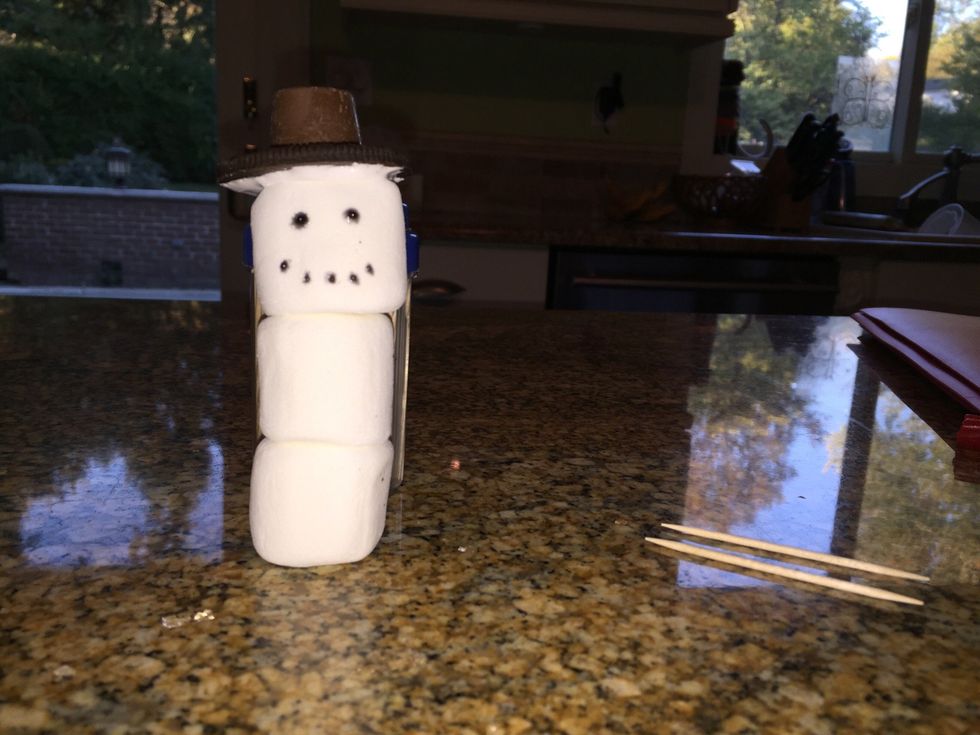 Put a Rolo on top of the Oreo. To make it extra sturdy, spread marshmallow fluff on the bottom of the Rolo before you place it on top of the Oreo.