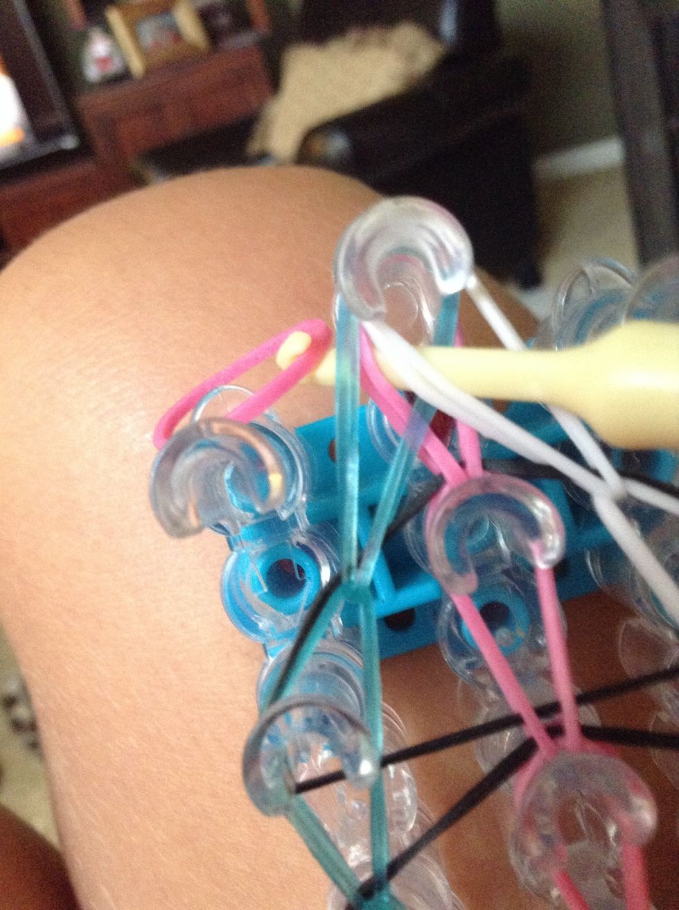 Put a rubber band the same color as the middle on the tip of the hook.