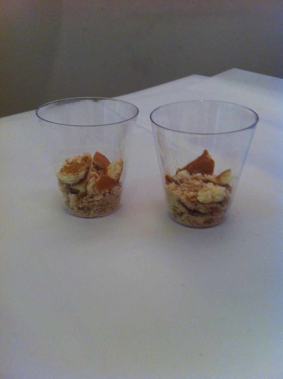 Put a scoop of crushed vanilla wafers on bottom of 2oz shot glass. You can grind it up fine, but personally I like a little crunch so I did it coarsely.