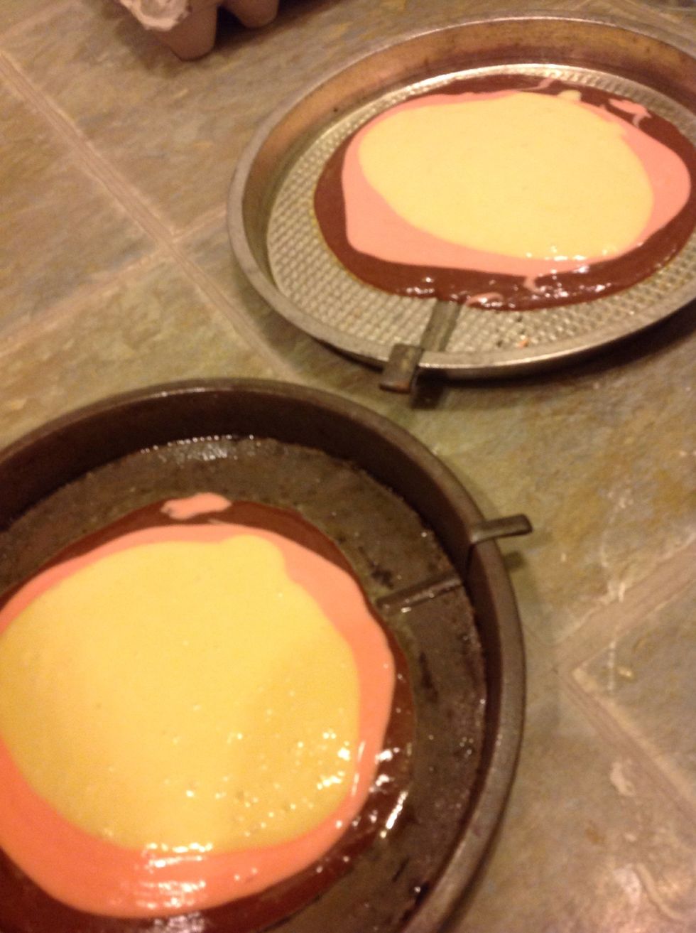 Put a scoop of strawberry and then put a scoop of vanilla on top of the chocolate.