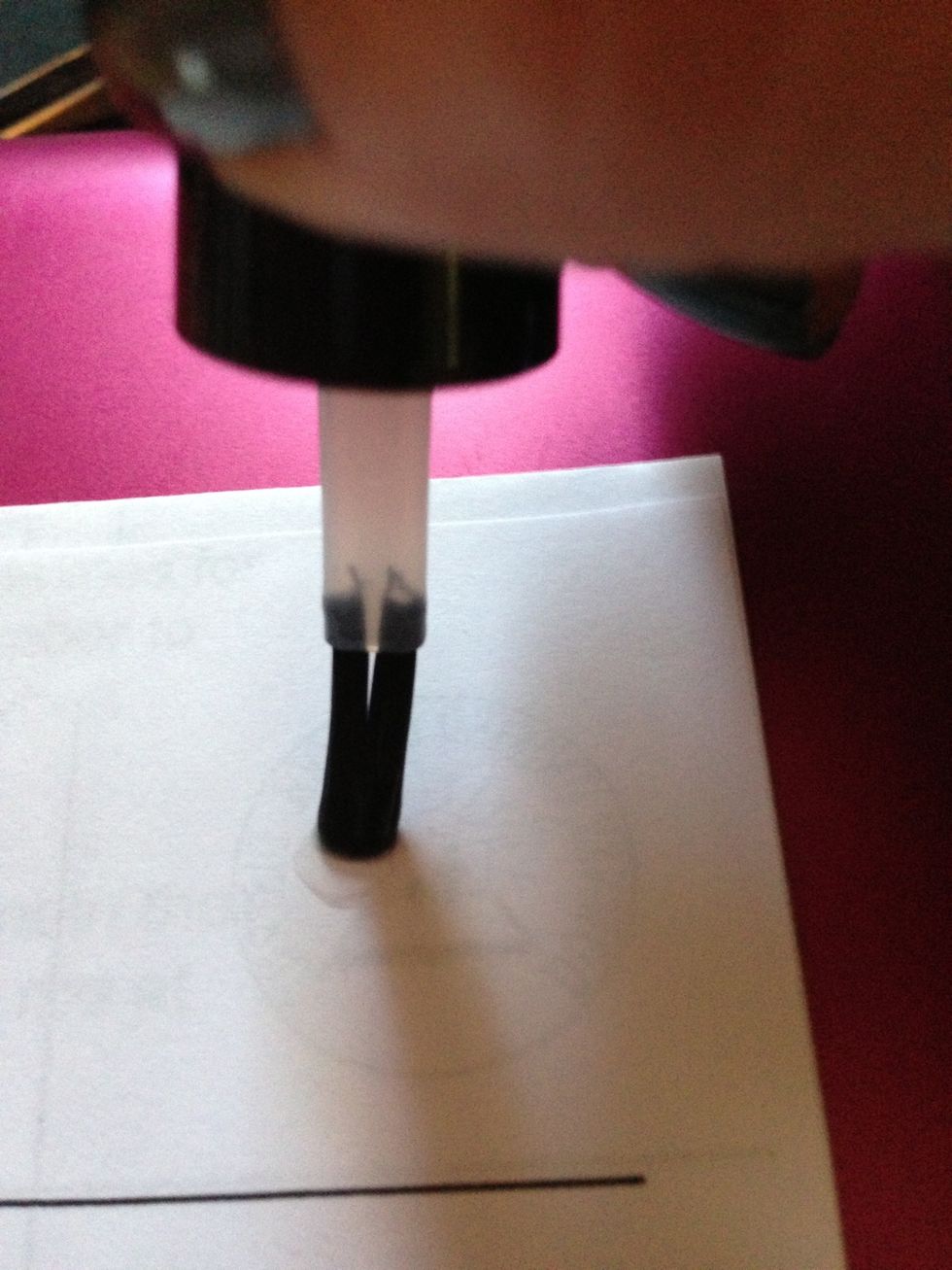 Put a small amount of clear top coat on a piece of paper