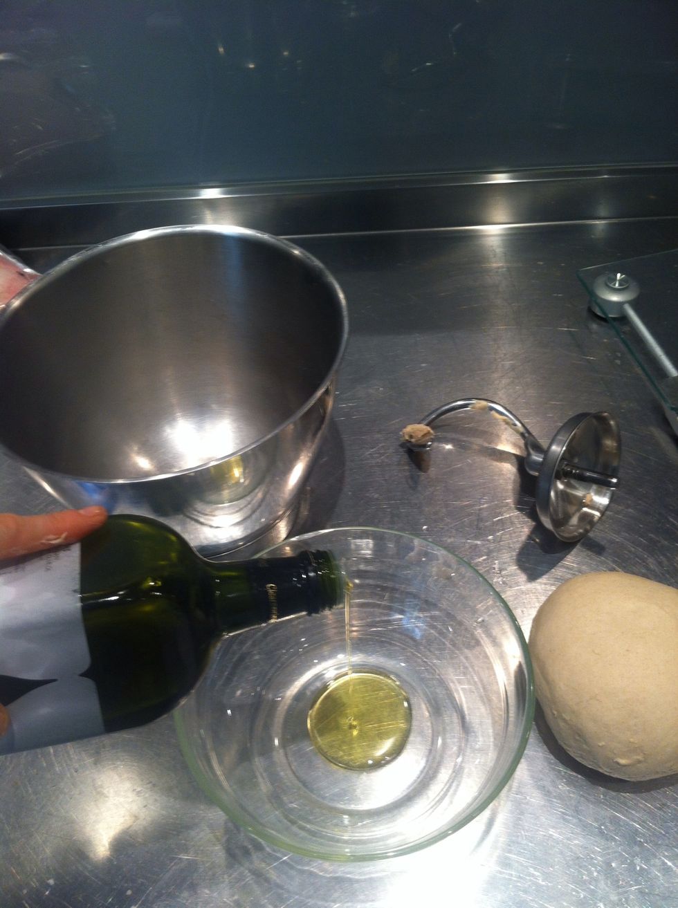 Put a small amount of olive oil into a glass bowl.
