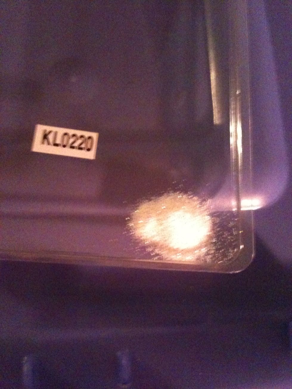 Put a small amount of your loose glitter in a tray. I used a white/silver crafting glitter I found at the dollar store.