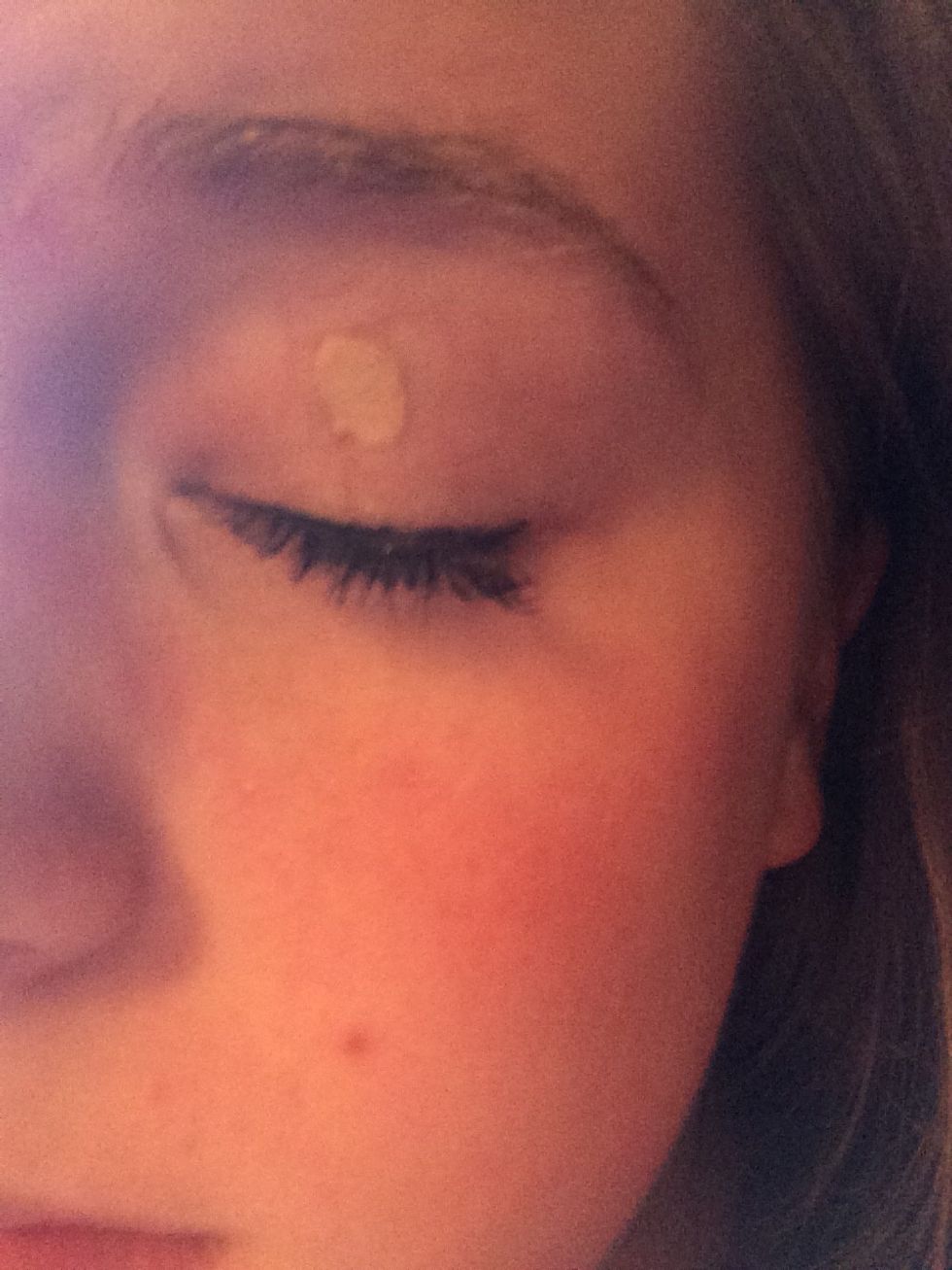 put a small dab of concealer on your lid and brow bone