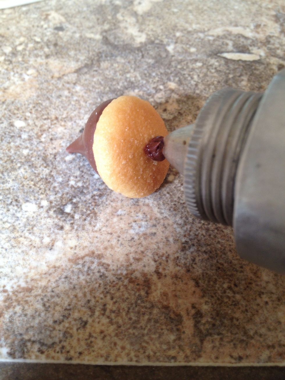 Put a small dot of frosting on the top of the Nilla wafer.