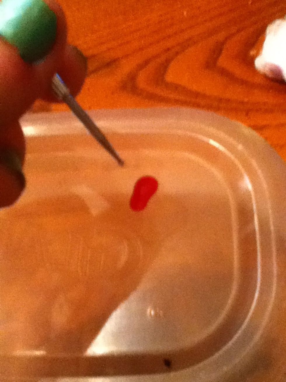 Put a small puddle of another color on a piece of scrap plastic and dip in your dotting tool.