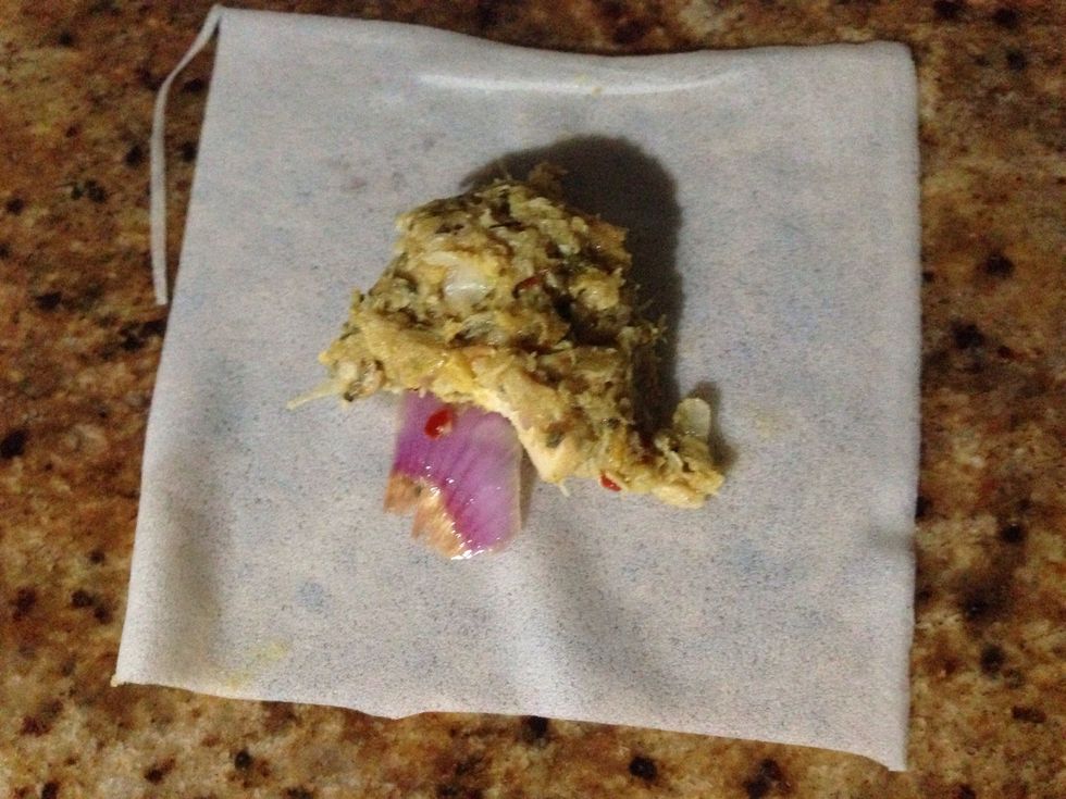 Put a spoonful of filling on the middle of the sheet