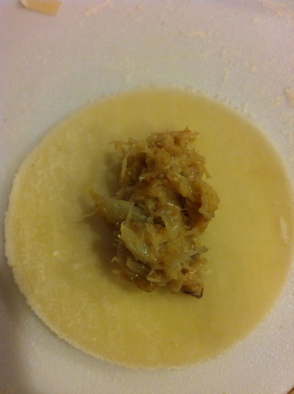 Put a spoonful of whatever filling your little heart desires. This is a crab mix.