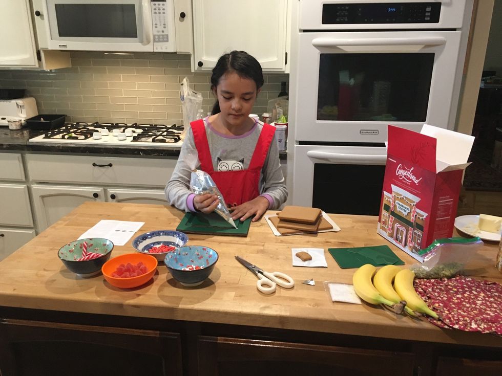 Put a steady layer of frosting is the creases of the cardboard.