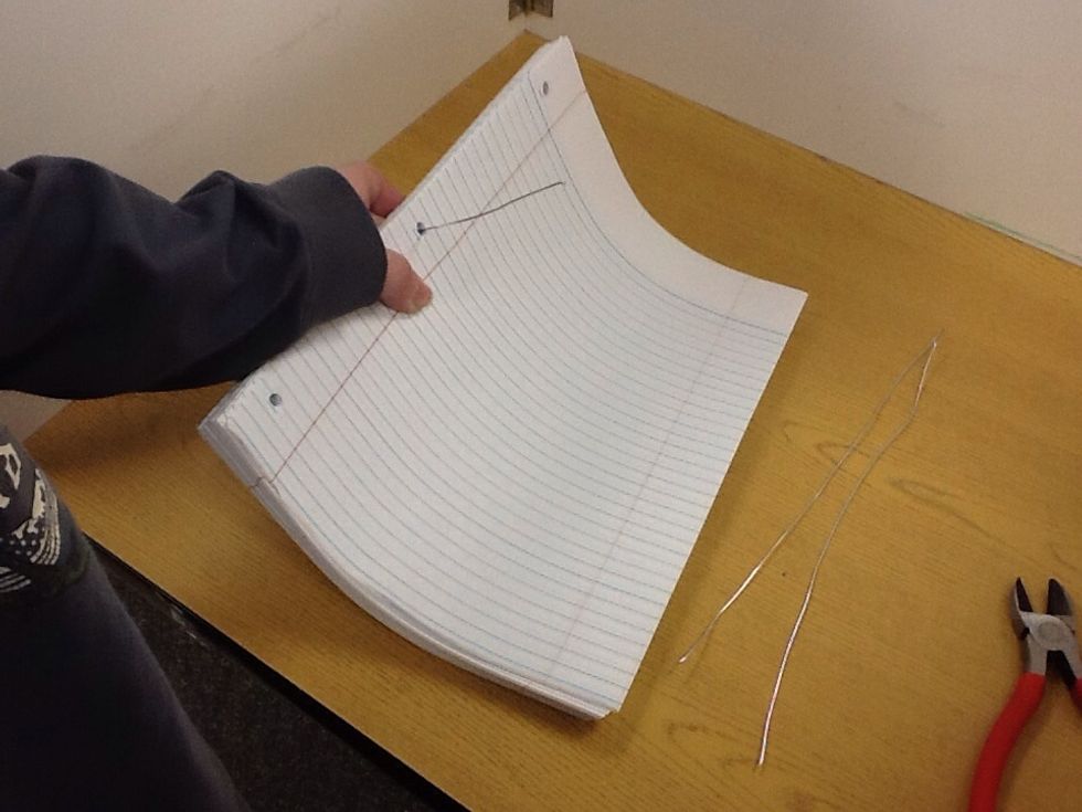 Put a strand into a hole.