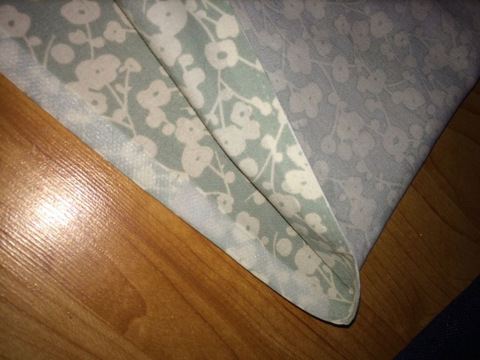 Put a strip all the way down the edge and iron down. You may need to put an extra piece of tape over the fabric that overlap for the flap opening. If you find any gaps try the iron longer to adhere.