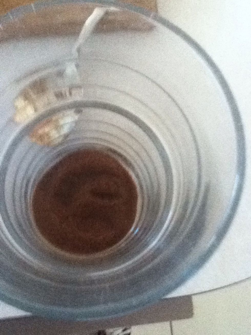 Put a teaspoon of the instant coffee in your glass