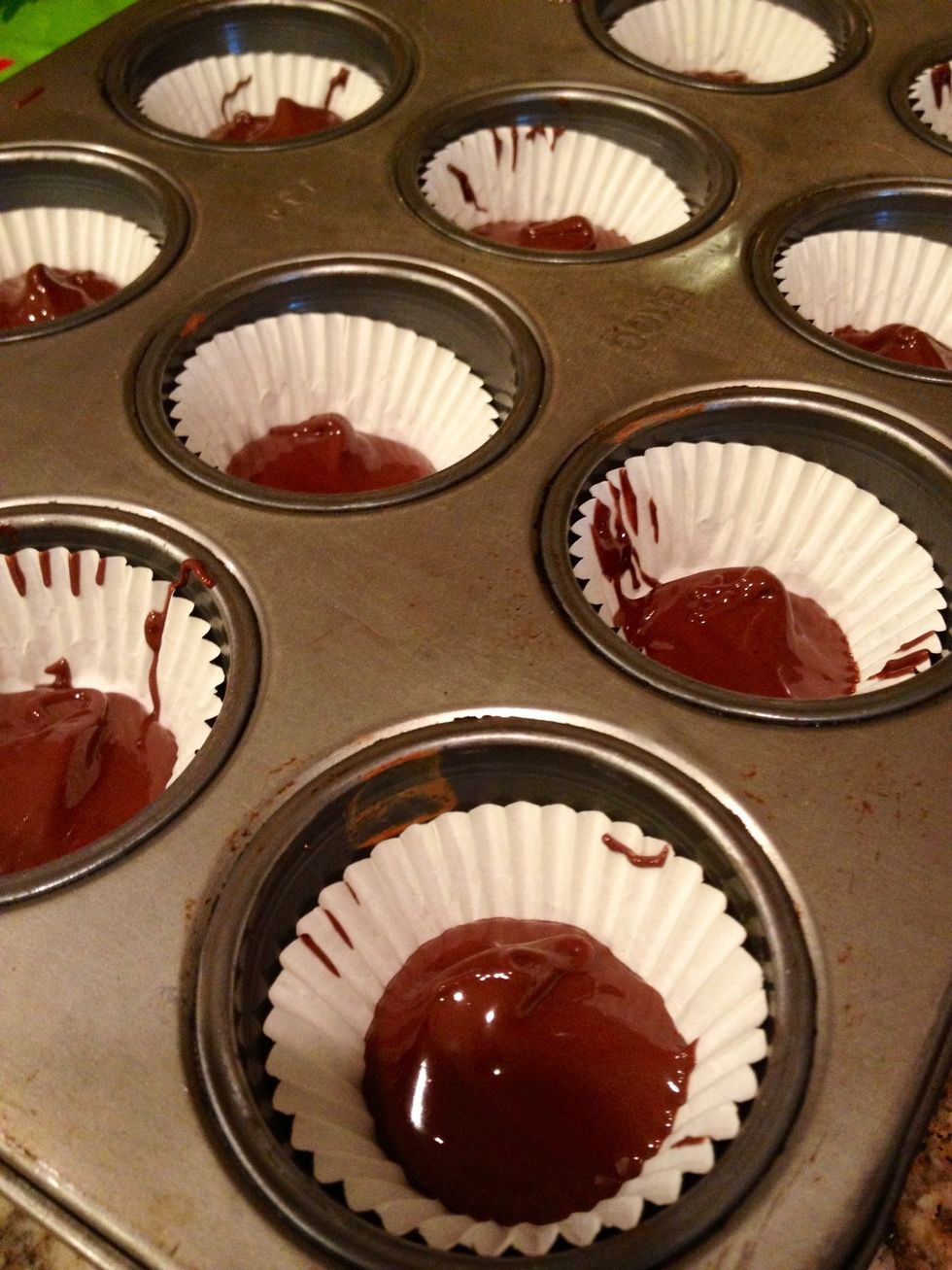 Put a teaspoon or two of the melted chocolate in the bottom of each cup.