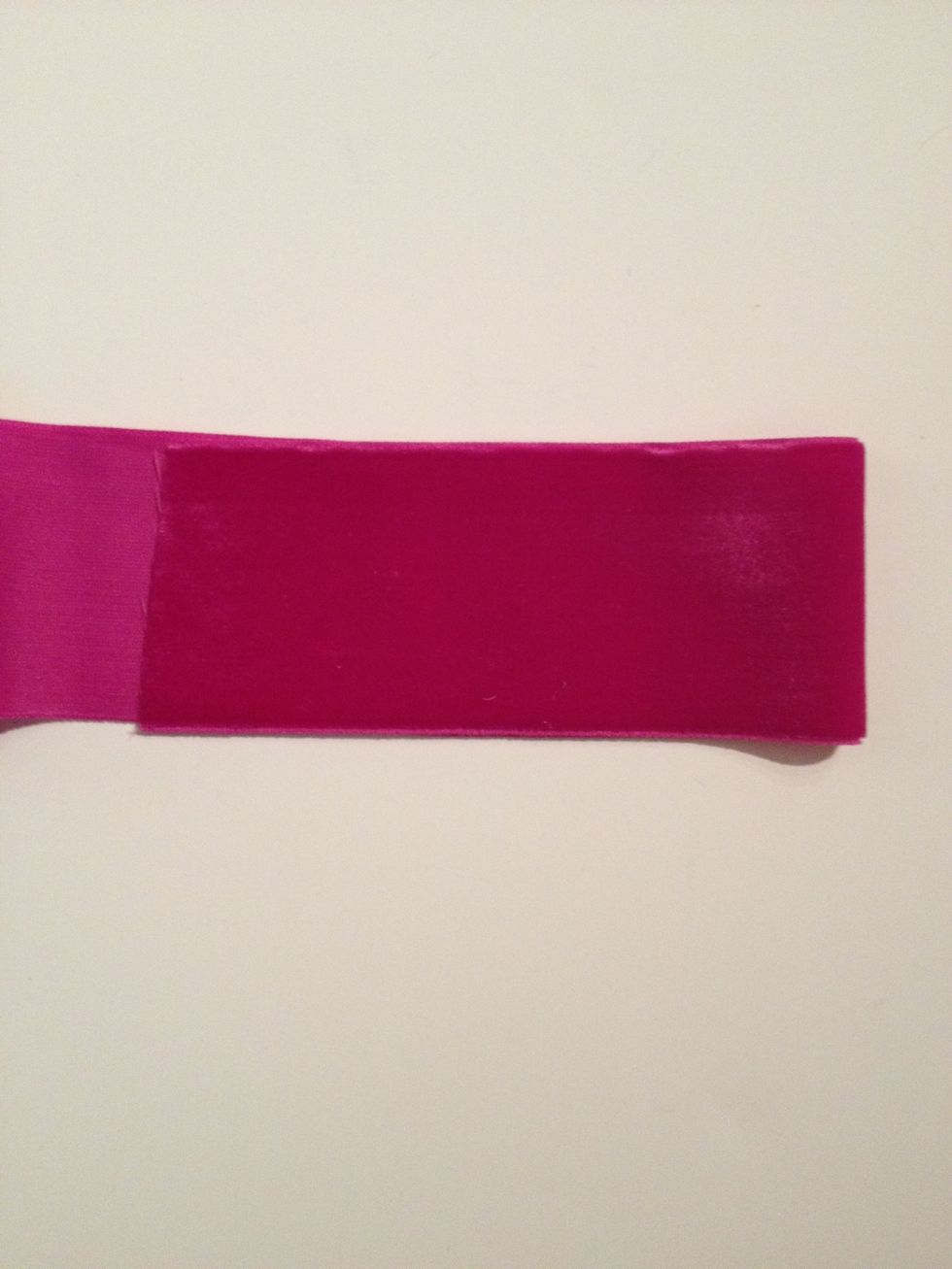 Put a thin layer of glue on one side of the ribbon and fold over. This will provide strength for the ribbon to attach to the end caps. The ribbon should measure approx 5" long now.
