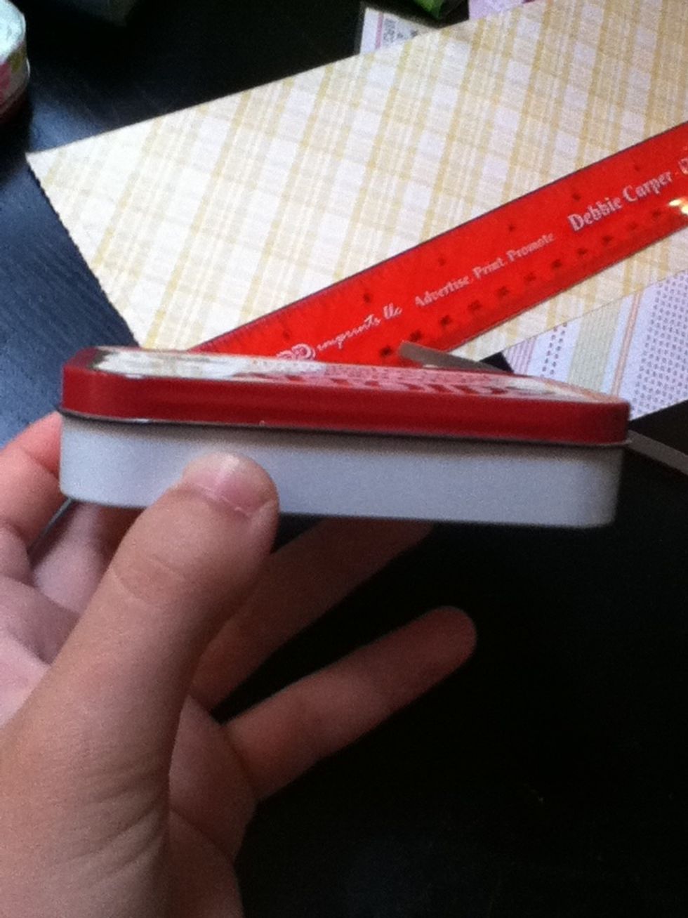 Put a thin layer of glue or double sided tape on the rim(for me the red part).