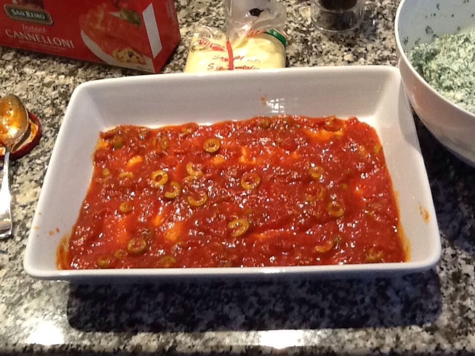 Put a thin layer of sauce on the bottom the dish