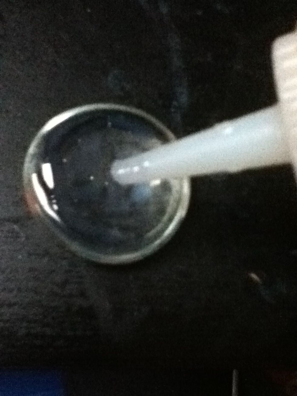 Put a thin layer of your paper glaze onto the back of the cabachon.