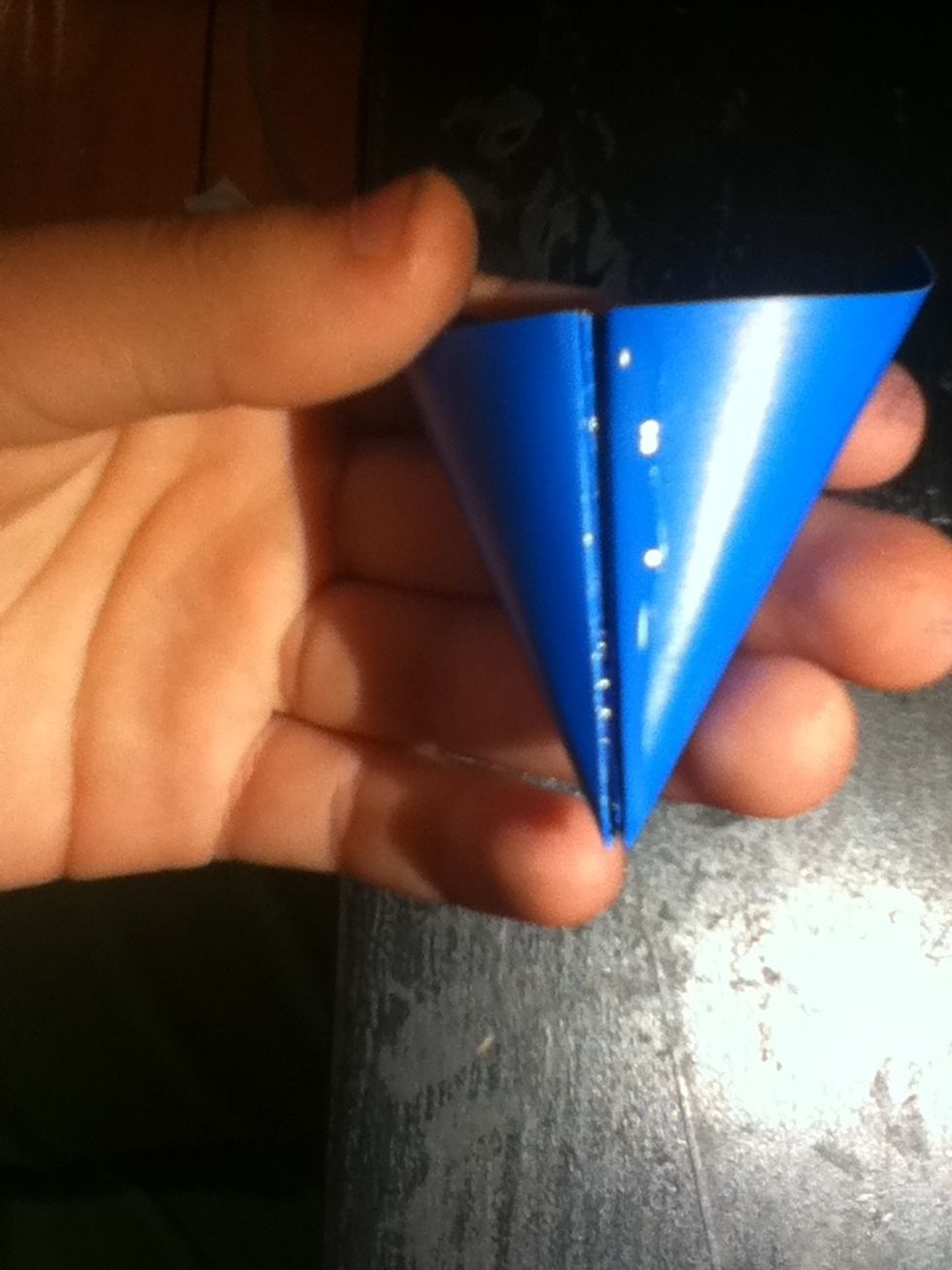 Put a thin strip of glue on the edge of one of your pairs.