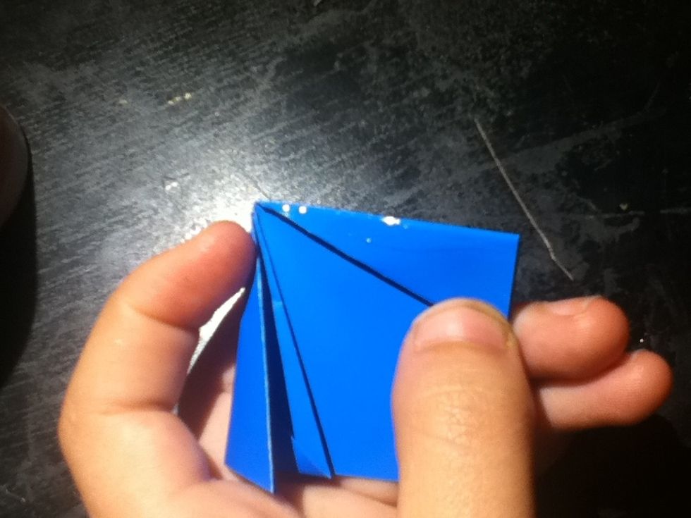 Put a thin strip of glue on the inside edge of one of the sides.