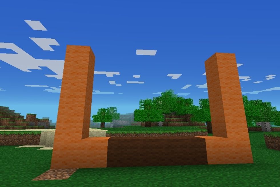 Put a tower of 4 orange wool on top