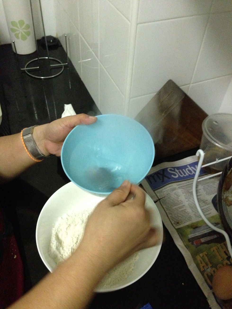 Put abit of hot water in the salt to blend n mix it in the flour